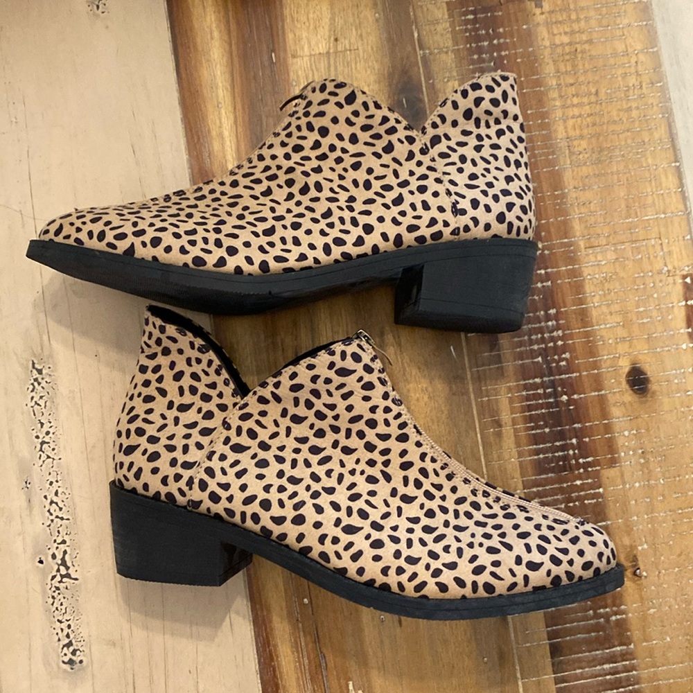 Never worn new, front zippered boots with heel